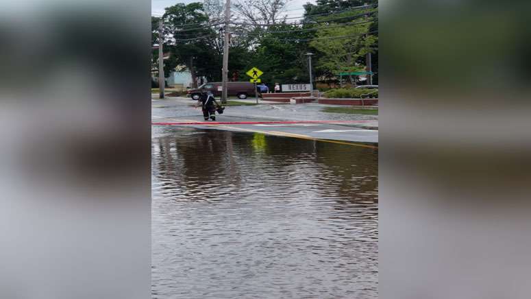 Crews repair major water main break that flooded street in Newton ...