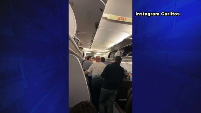 Police arrest man who barged onto American Airlines flight - Boston ...