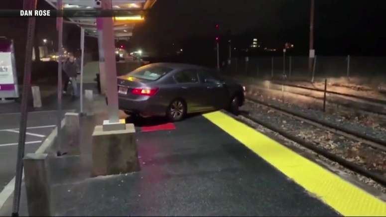 Commuter rail trains delayed after car gets stuck on tracks in ...