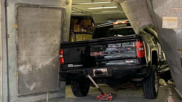 Person left trapped after idling pickup truck accelerates into Boston ...