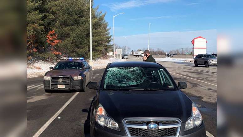 Driver escapes injury after ice crashes through windshield on I-93 in ...
