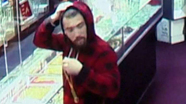 Man caught on camera smashing case, making off with merchandise at ...