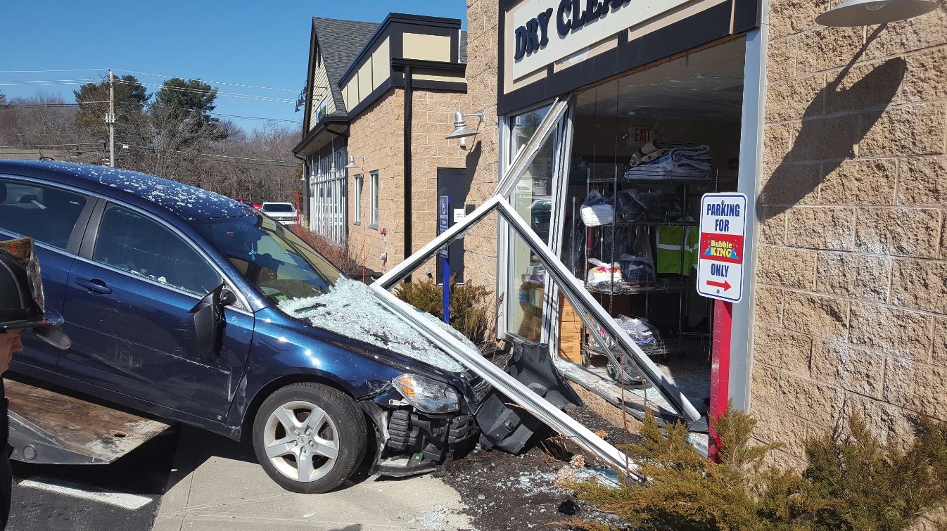 Fire officials investigating after car crashes into Plainville business