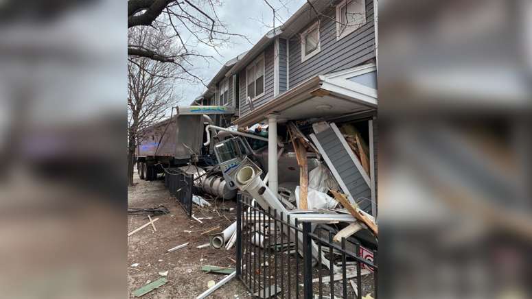 Emergency crews responding after dump truck crashes into building in ...