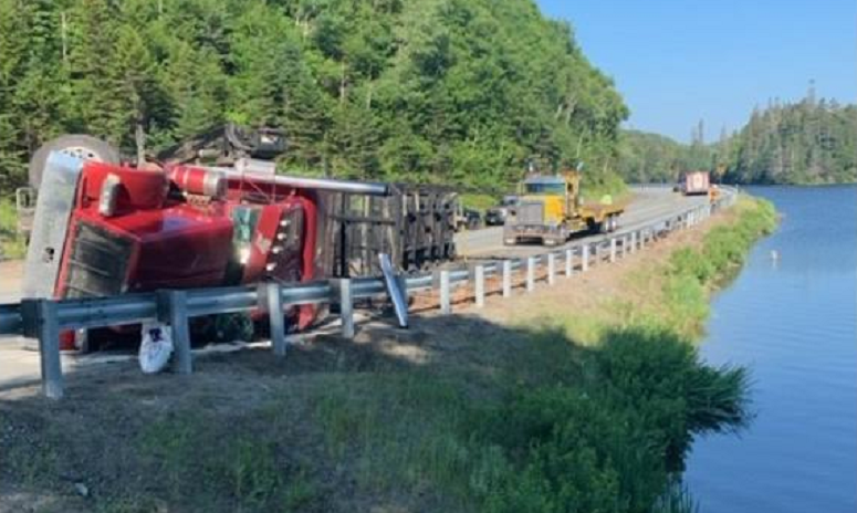 Logs end up in NH lake after tractor-trailer overturns on roadway ...