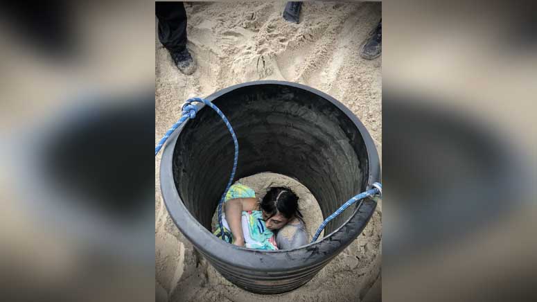 Emergency Crews Rescue 15 Year Old Girl From Hole After Sand Collapses