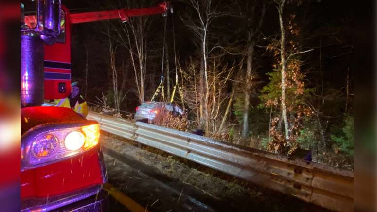 Person hospitalized after car goes over guardrail, down embankment in ...