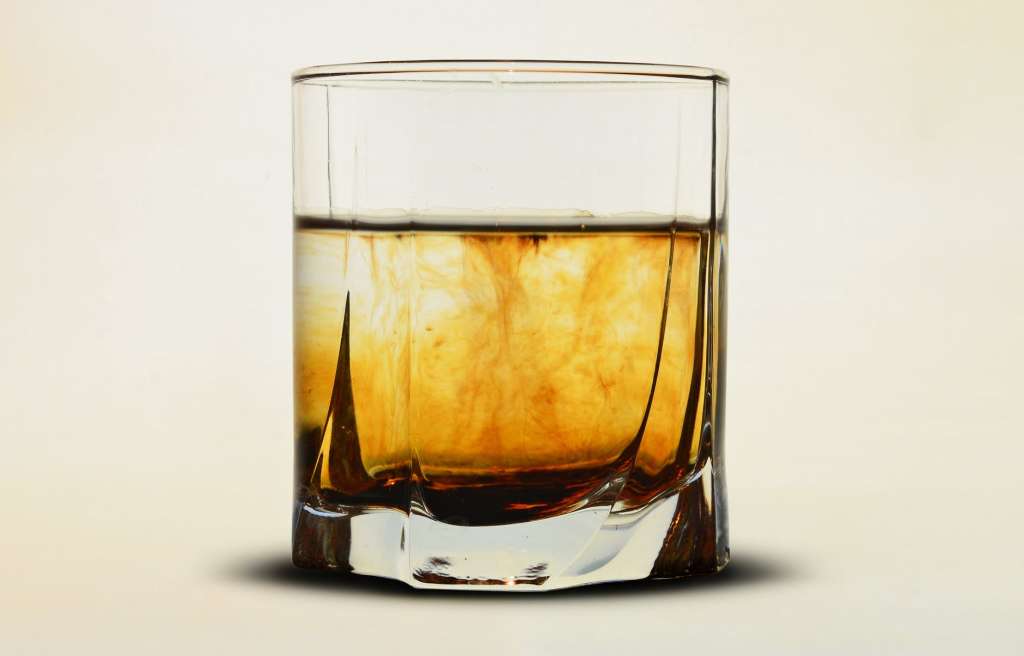 clear glass with brown liquid