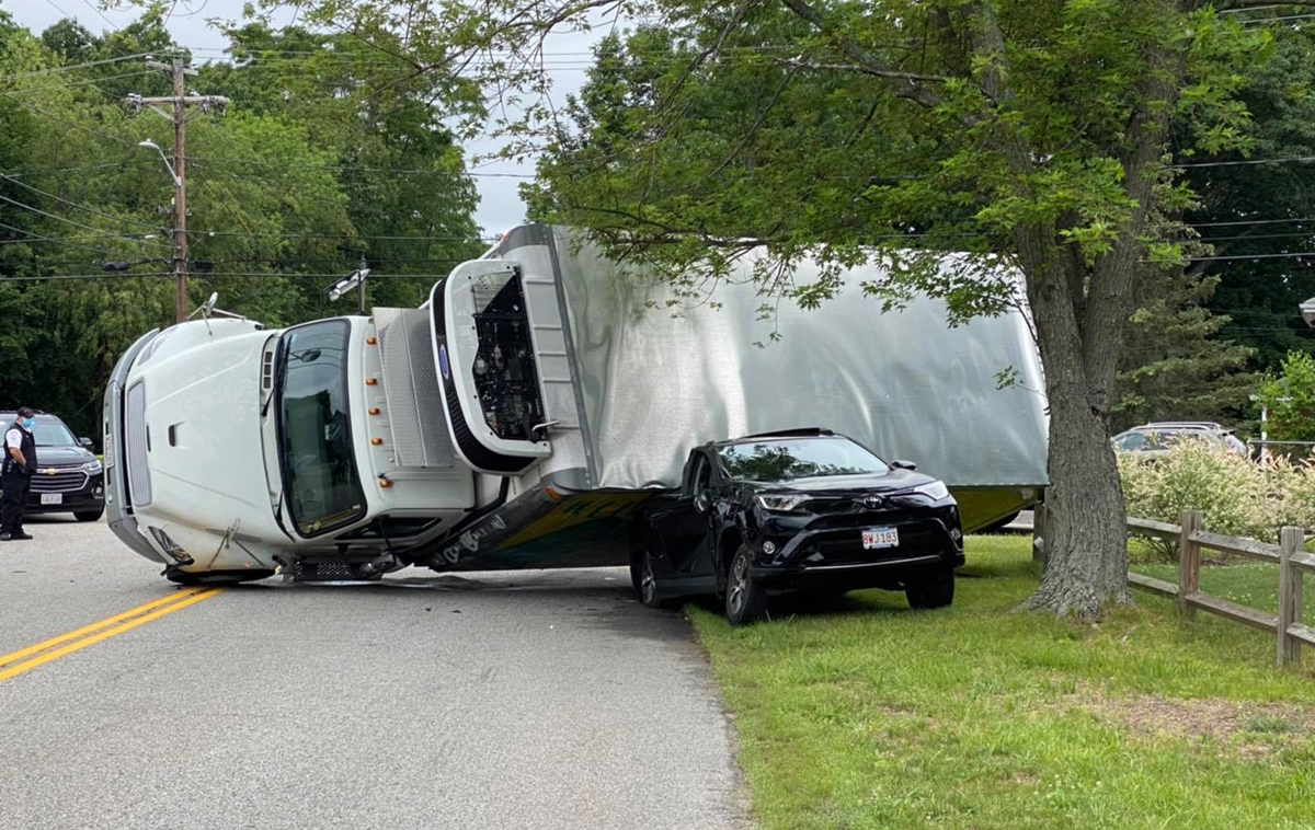 Investigation underway after truck rolls over, lands on car in