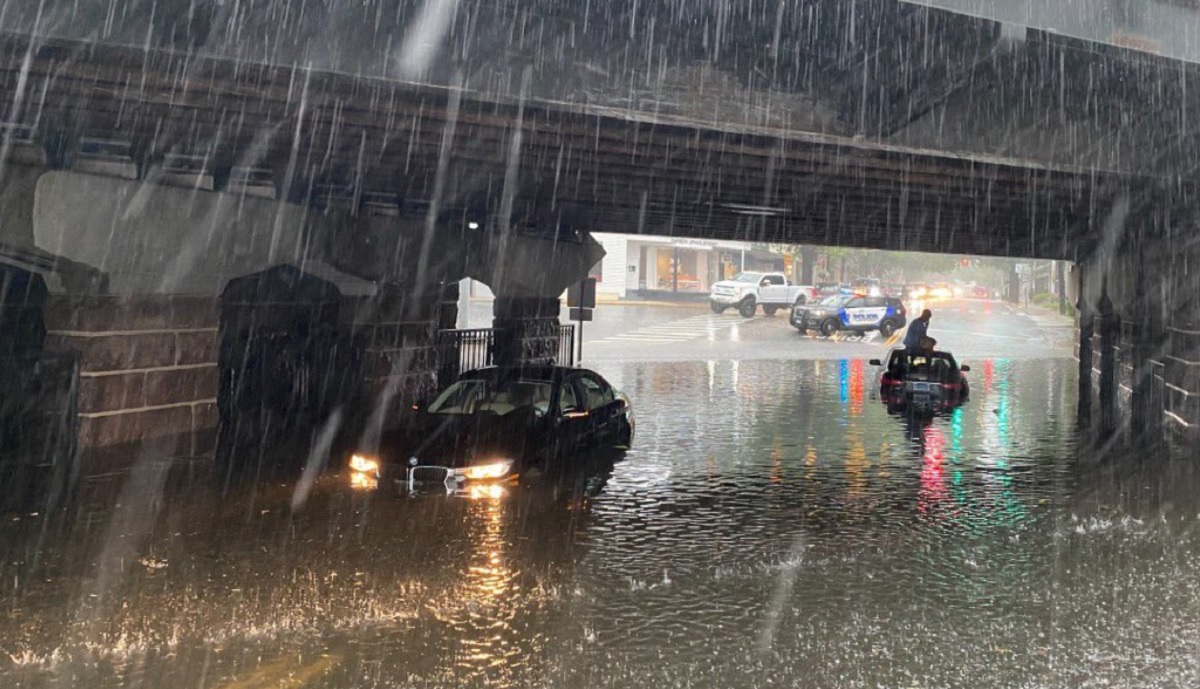 Heavy flooding leaves cars stuck underneath bridge in Connecticut