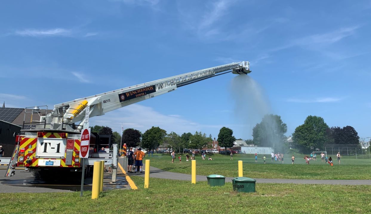 Winchendon Fire Department keeping residents cool by misting water onto