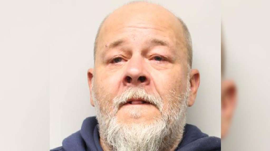 Police arrest erratic man caught on camera running around with large