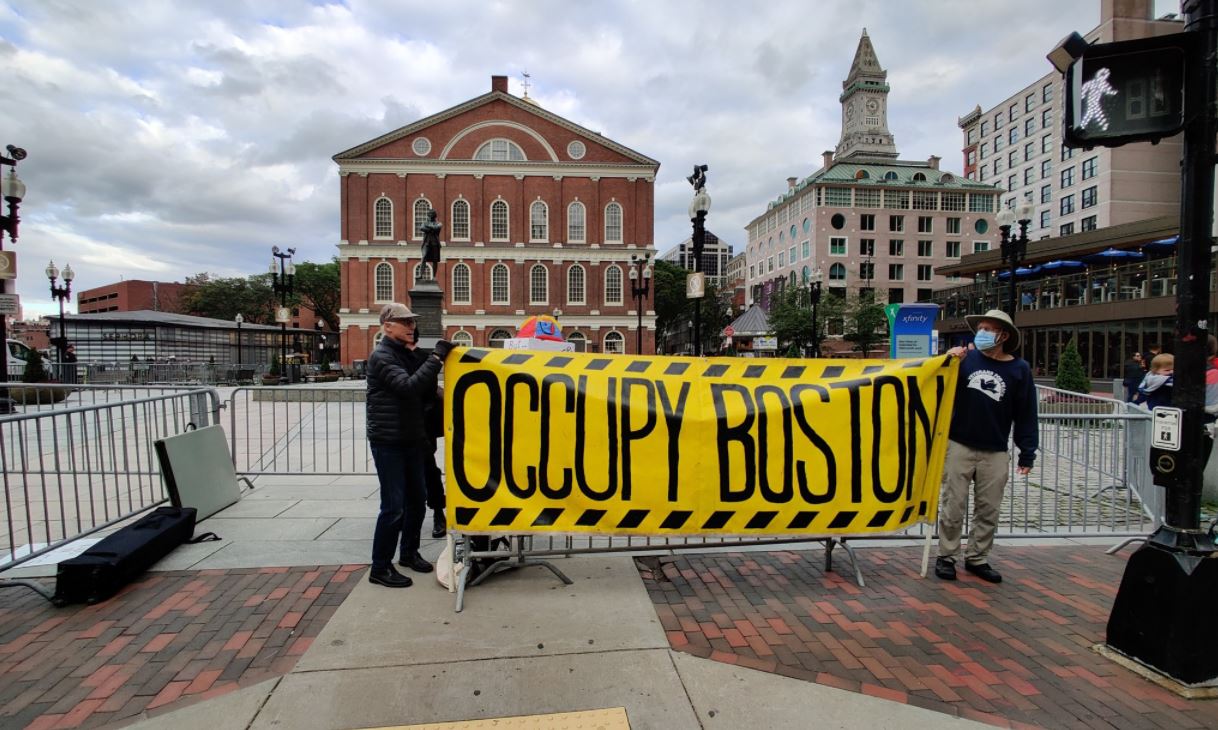 Occupy Boston gathers at Faneuil Hall to call for name change of