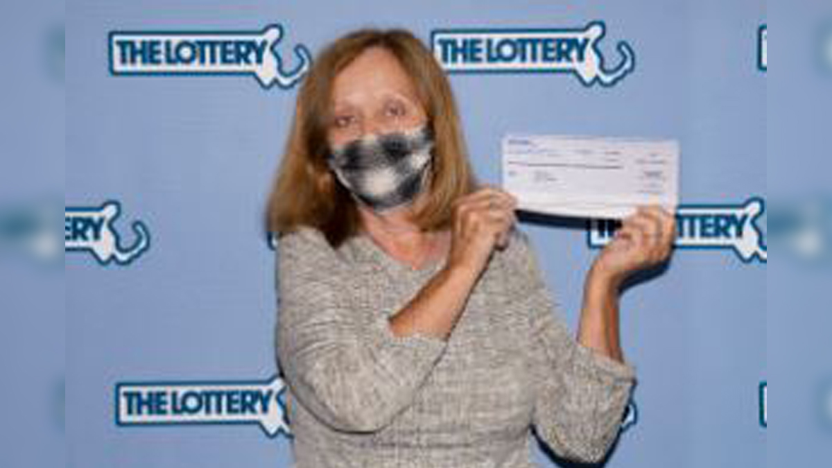 Woman planning big vacation after winning 1M lottery prize on scratch