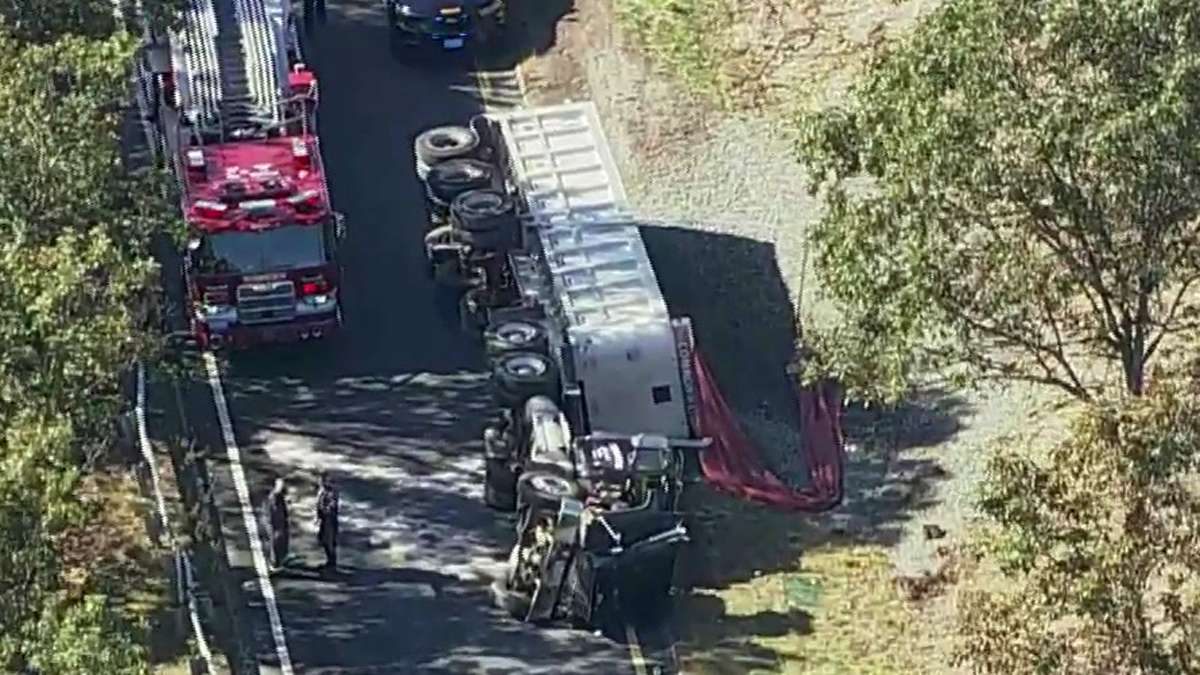 Ramp to I-95 closed after truck hauling gravel rolls over in Woburn ...