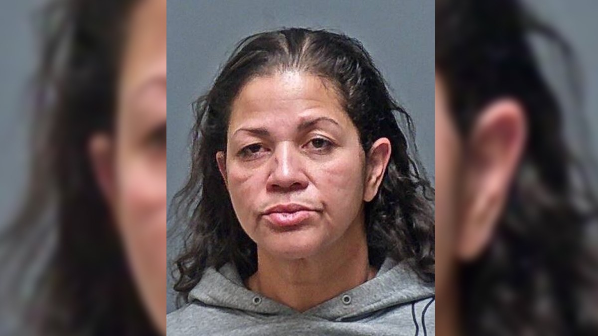Police: Woman arrested after man wrestled gun away from her during ...