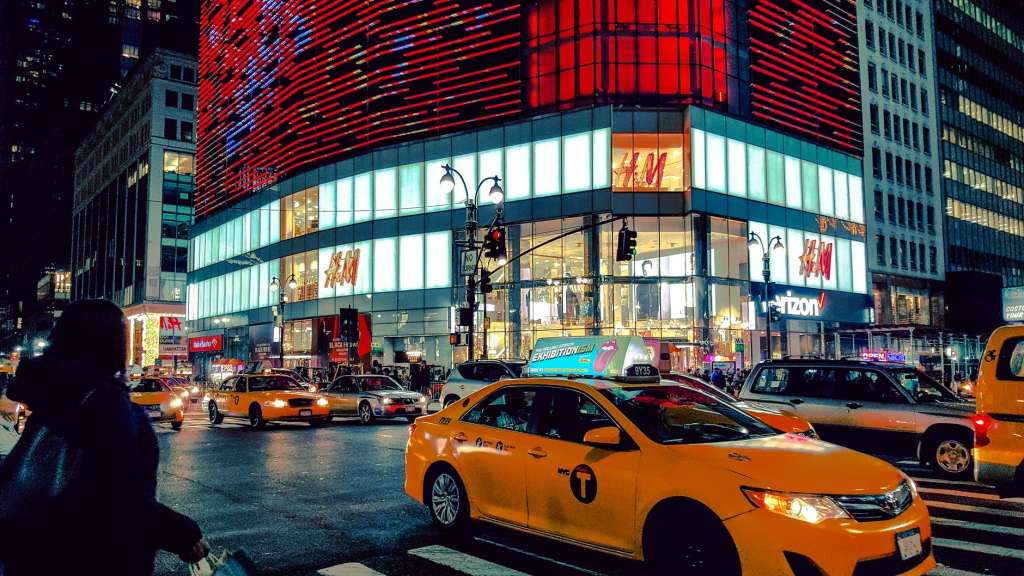 time lapse phot oof a yellow car