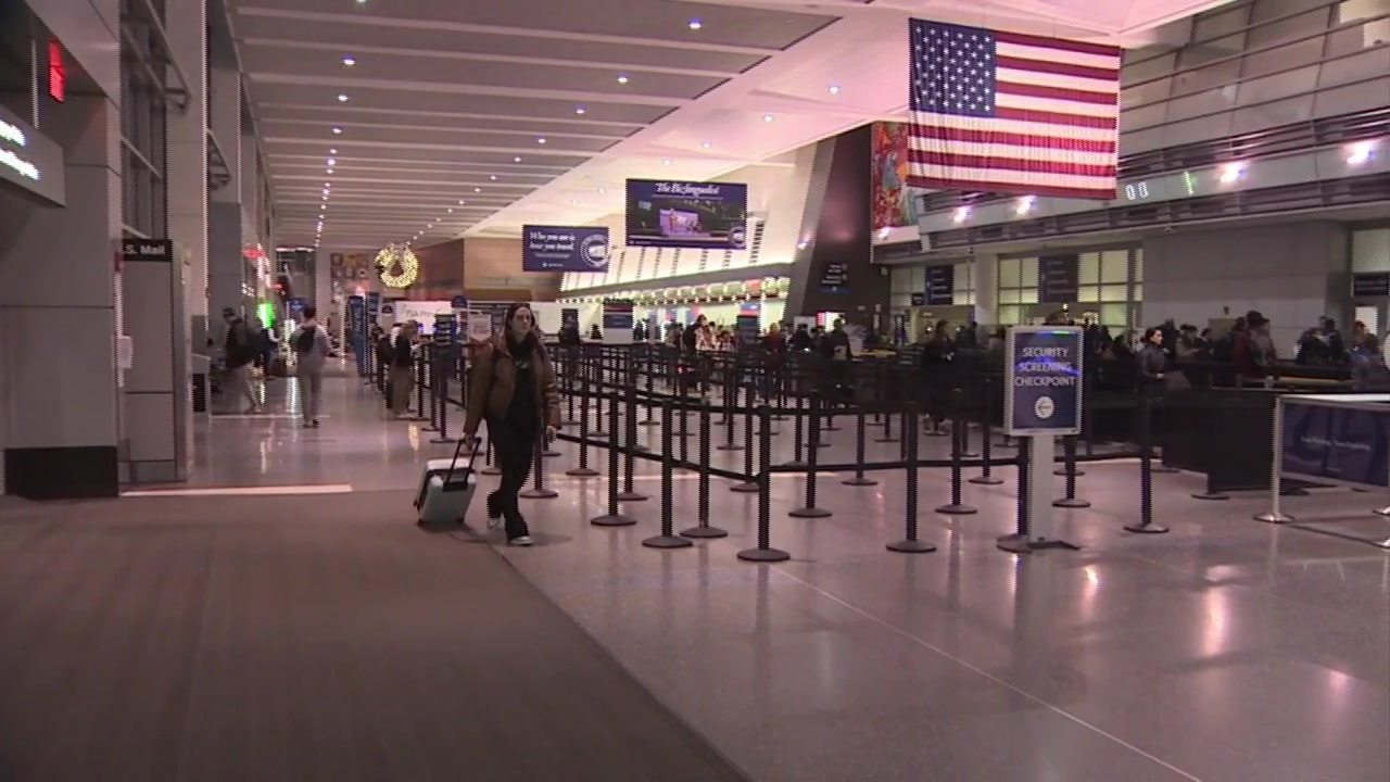 People flock to Logan Airport as holiday travel hits its peak Boston