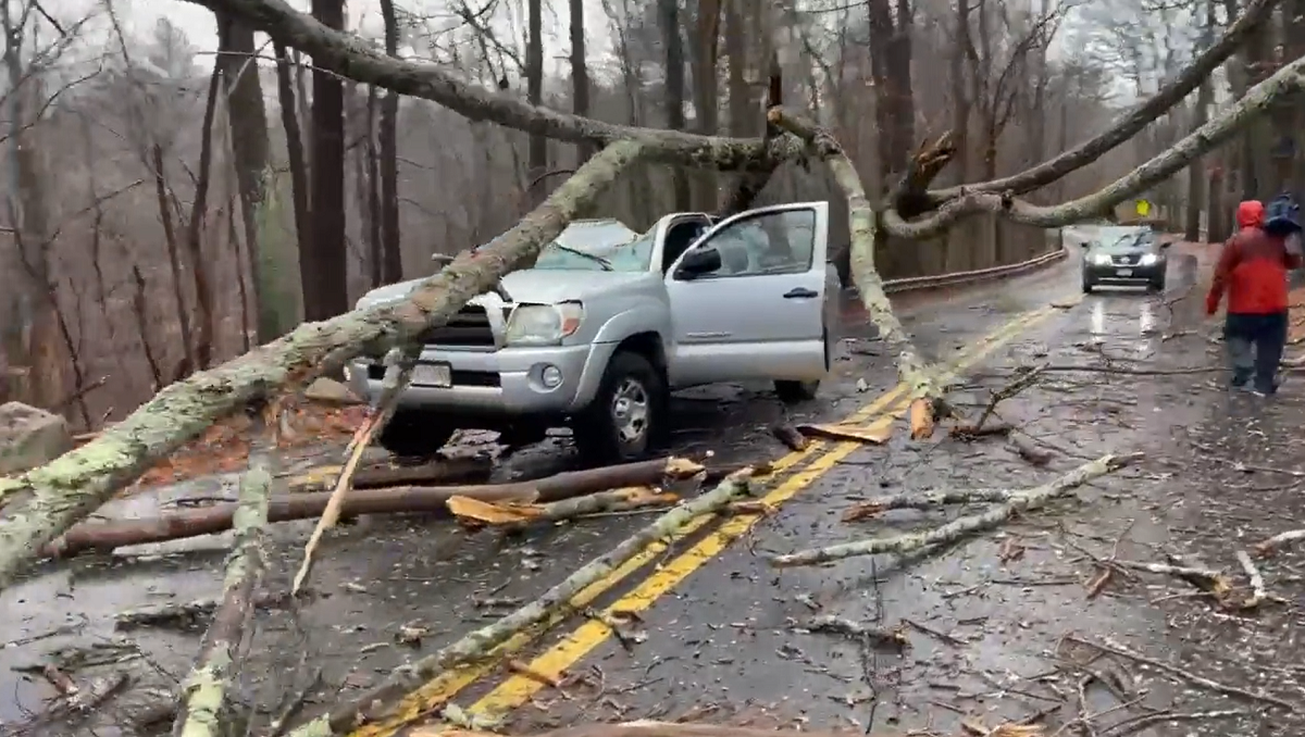 Storm system leaves thousands without power before bitter cold arrives ...