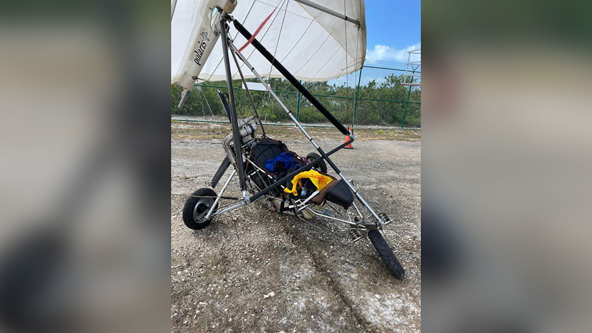 Cuban migrants fly into Key West airport on motorized hang glider