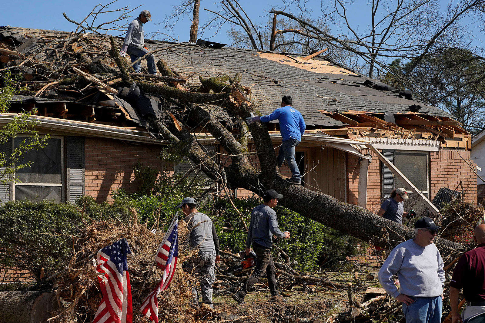 Tornado-ravaged communities look to rebuild after storms level homes and leave 32 dead