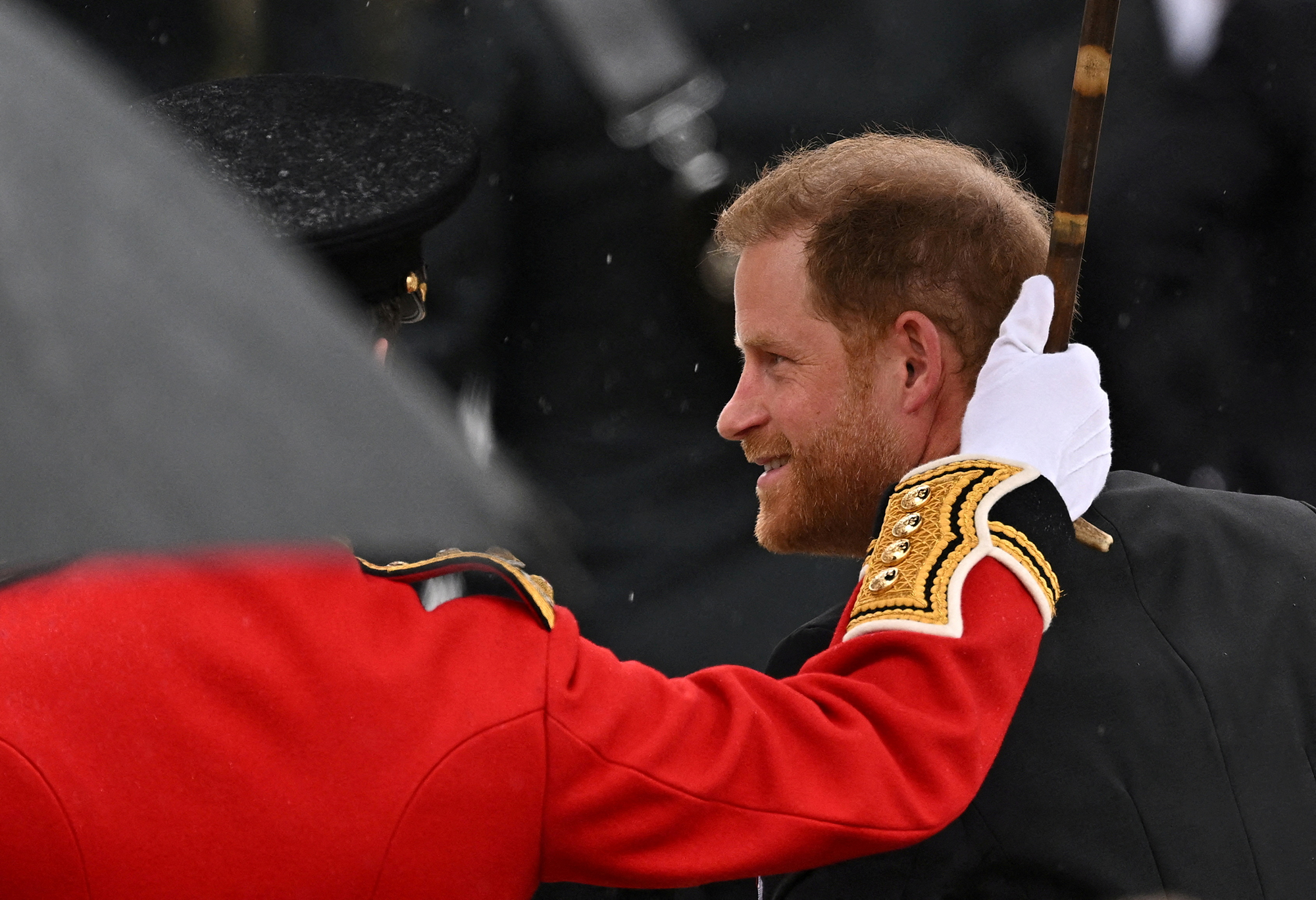 Prince Harry attends coronation ceremony as tensions with family run