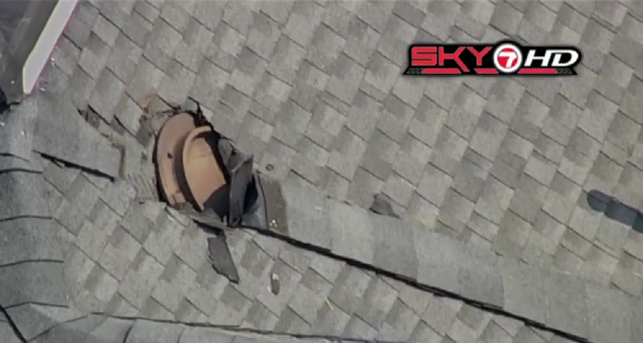 ‘Underground explosion’ shatters windows, leaves crater in road and