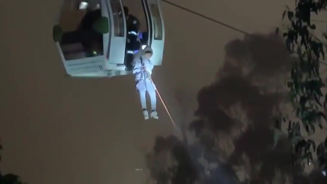 Rescuers free dozens trapped on one of world’s highest cable car
