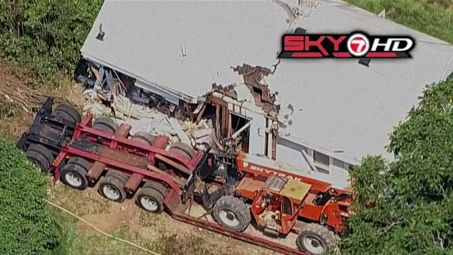 Tractortrailer driver in critical condition after truck crashes through vacant home in Bellingham  Boston News Weather Sports  WHDH 7News