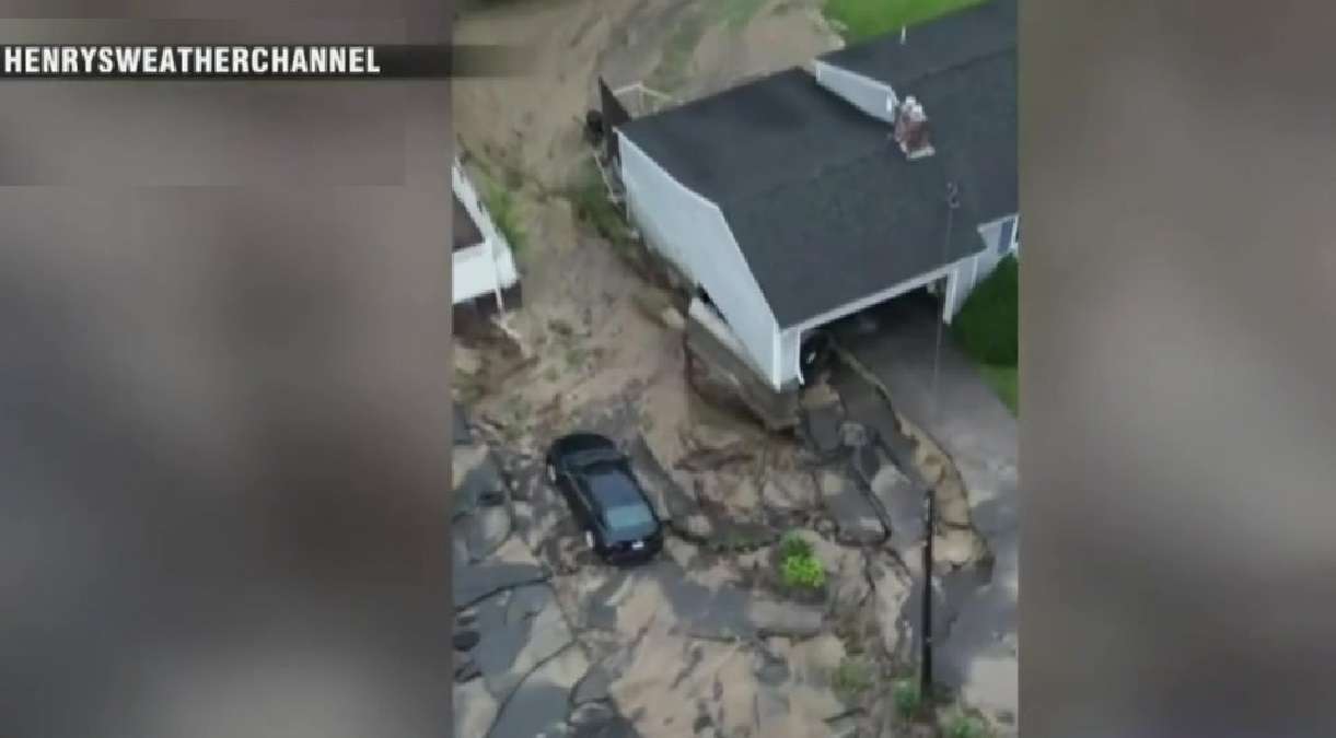 WATCH: Flooding, torrential downpours in Leominster leave vehicles dangling from driveways, car lot caving into river - Boston News, Weather, Sports - Vimarsana News