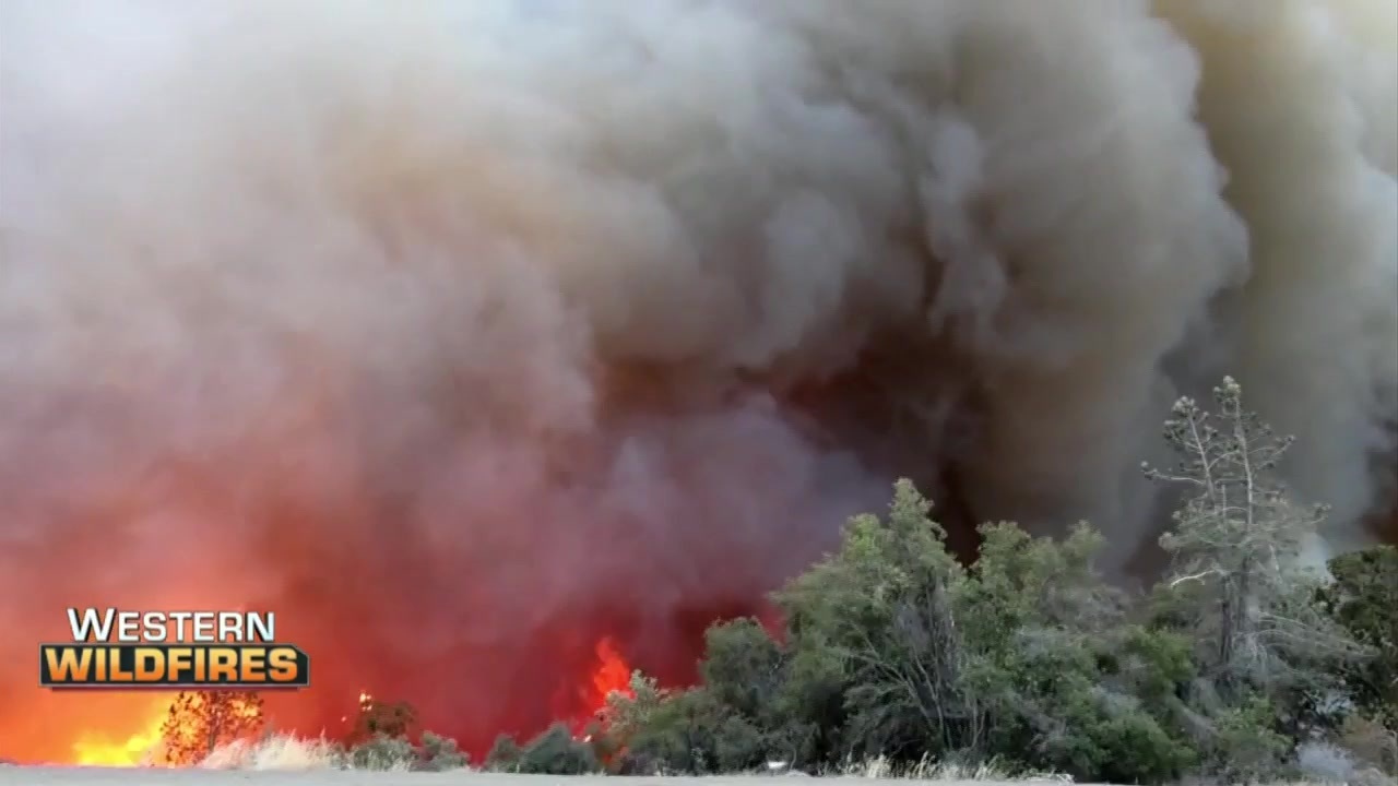 Fast-moving San Bernardino wildfire torches hillside community, forcing