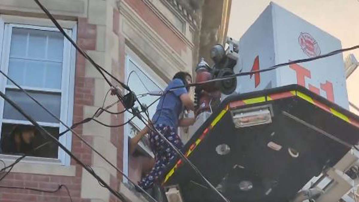 Chelsea firefighters rescue residents from burning building - Boston ...