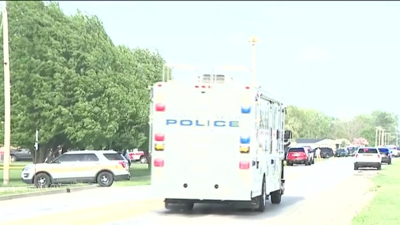 Four people were killed when vehicle smashed through Illinois building, police say