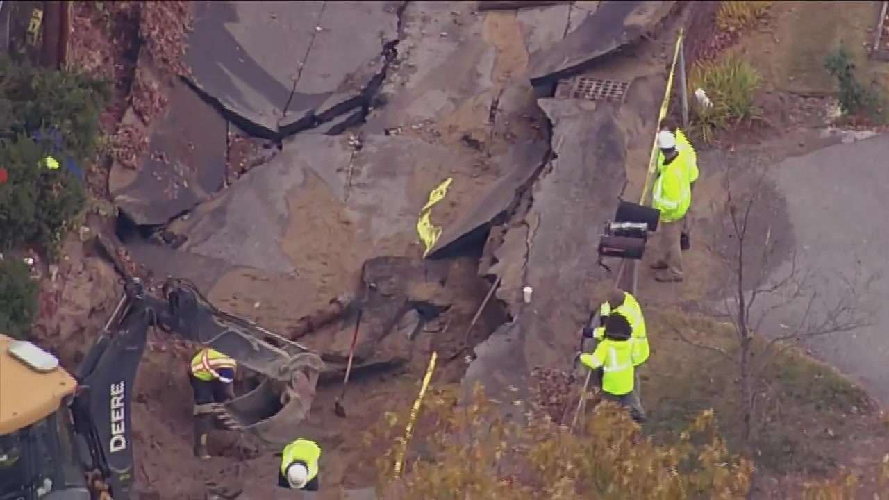 Road caves in, homes flood in Westford after water main break - Boston ...