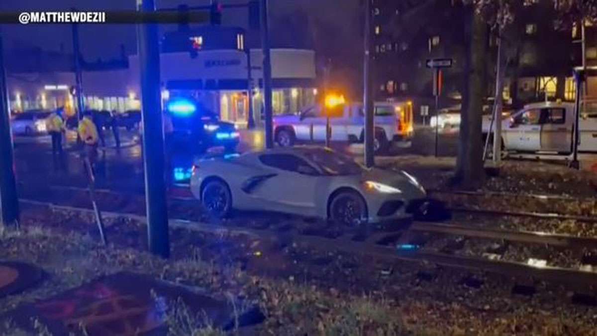 Service disrupted after sports car gets stuck on Green Line tracks in ...