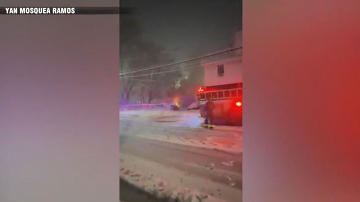 Crews battle garage fire in Lawrence