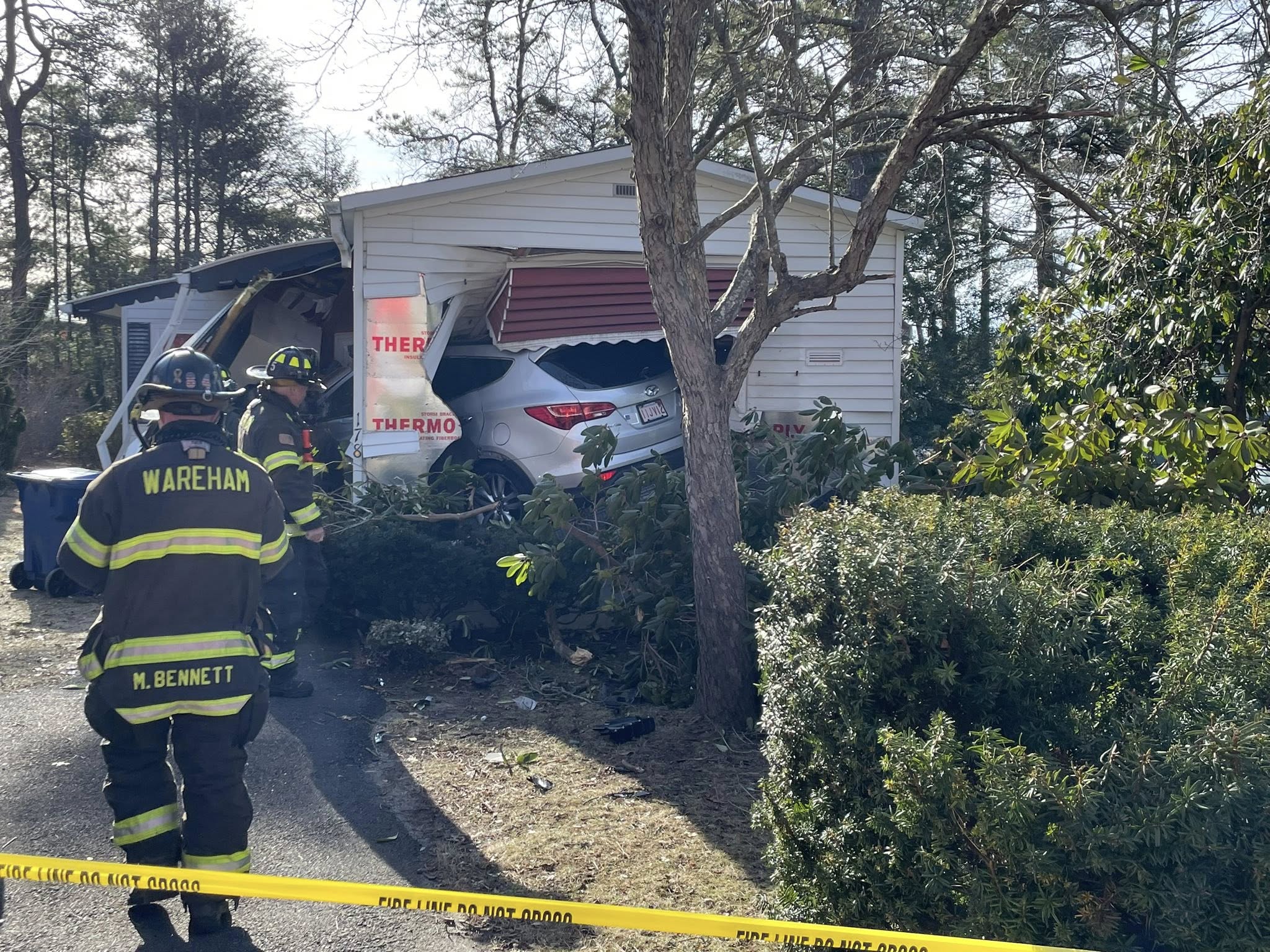 Crews respond after car crashes into Wareham house