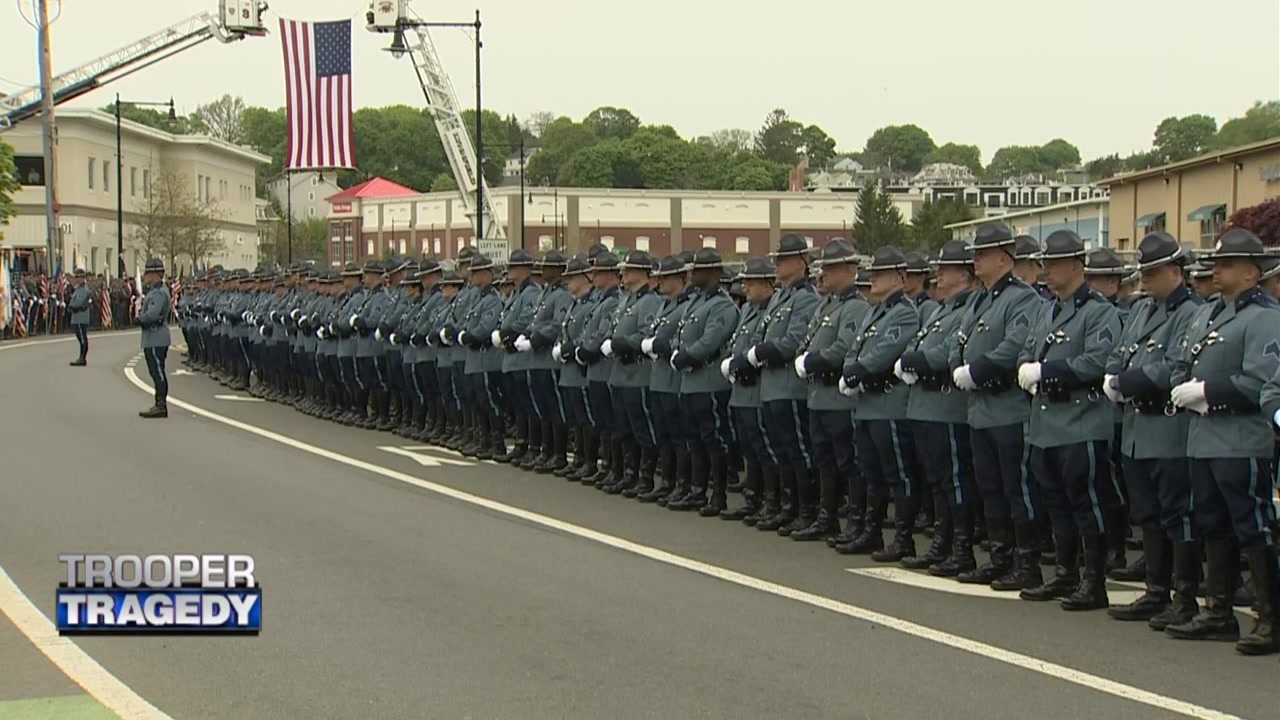 Law enforcement lines the streets to pay respects to fallen Massachusetts State Trooper