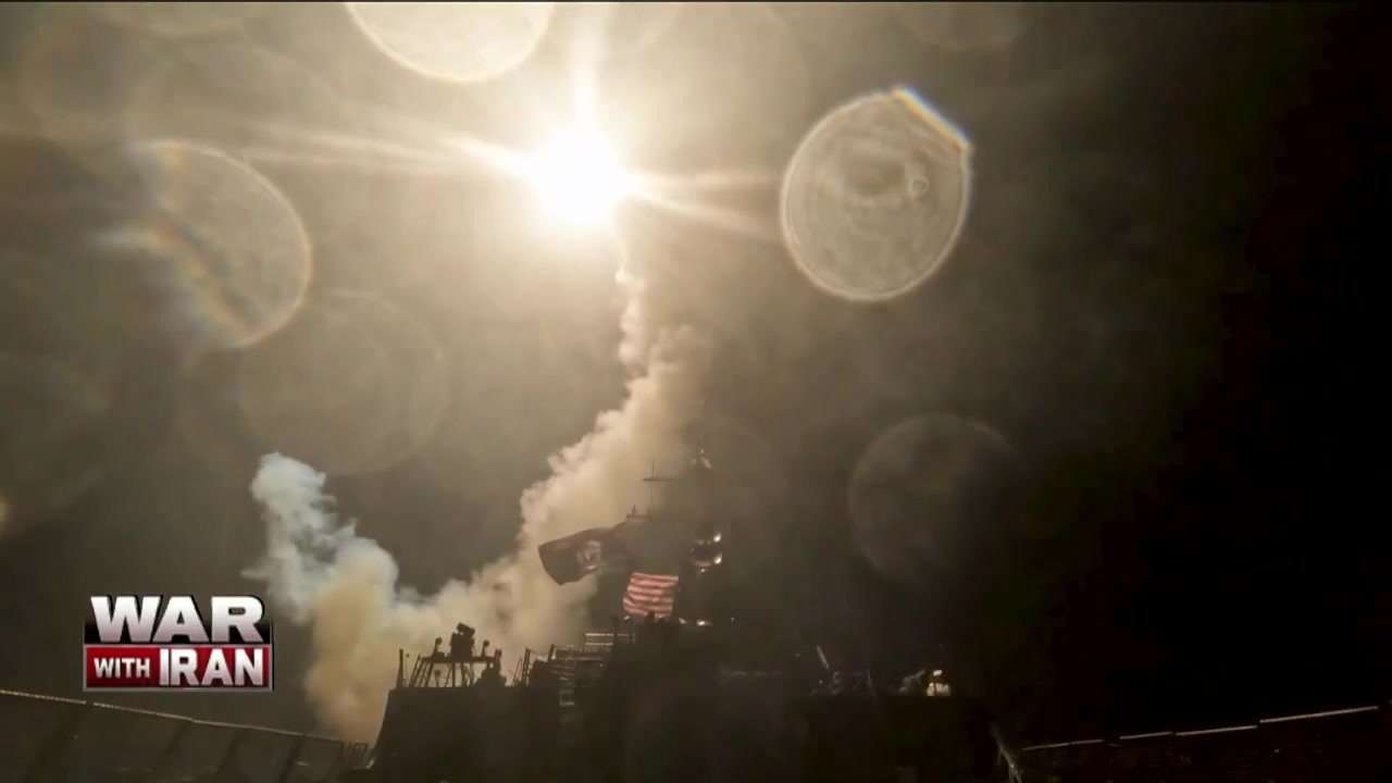 US strikes bridges and collapses a tower at a key port as its Iran campaign expands
