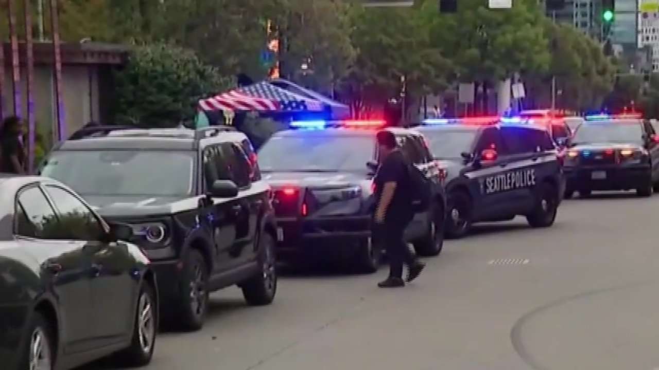 Police arrest 1 person and search for another after Seattle festival shooting that killed 3