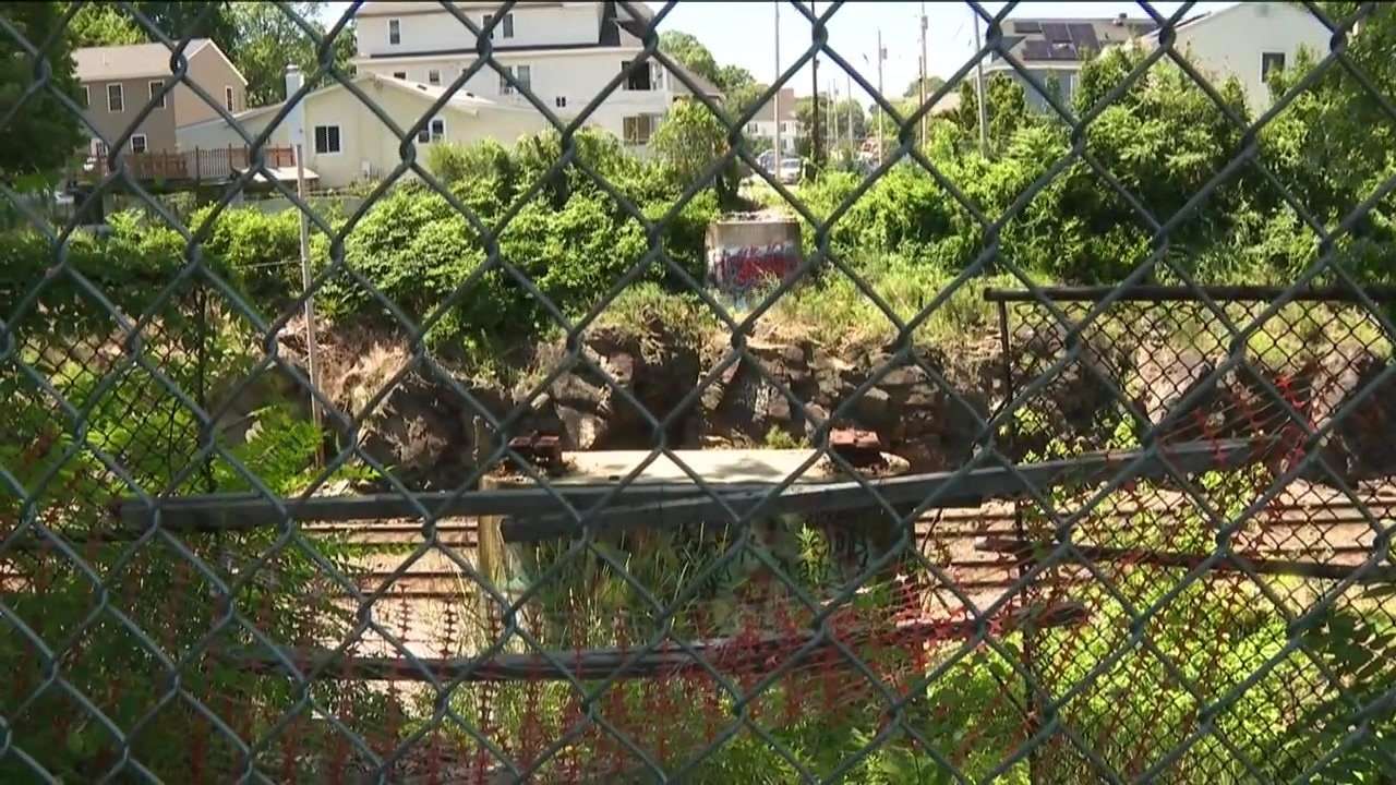 Firefighters rescue woman who fell 30 feet onto train tracks in Lawrence