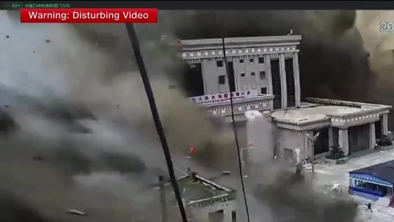 Rescuers retrieve flood survivors caked in mud as death toll in Nepal
