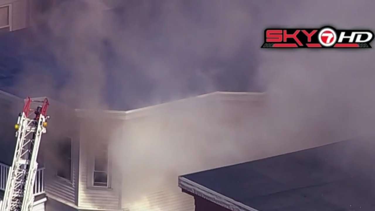 Crews battle triple-decker fire in Malden