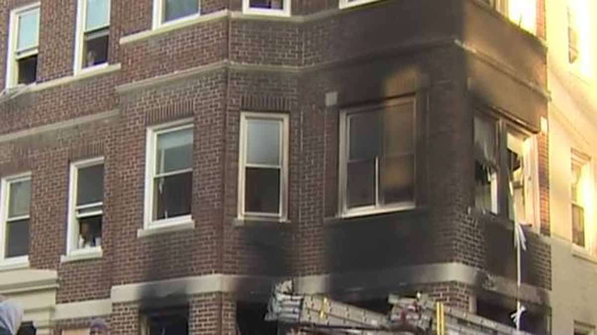 2 hospitalized after firefighters rescue 6 people from burning building in Brighton