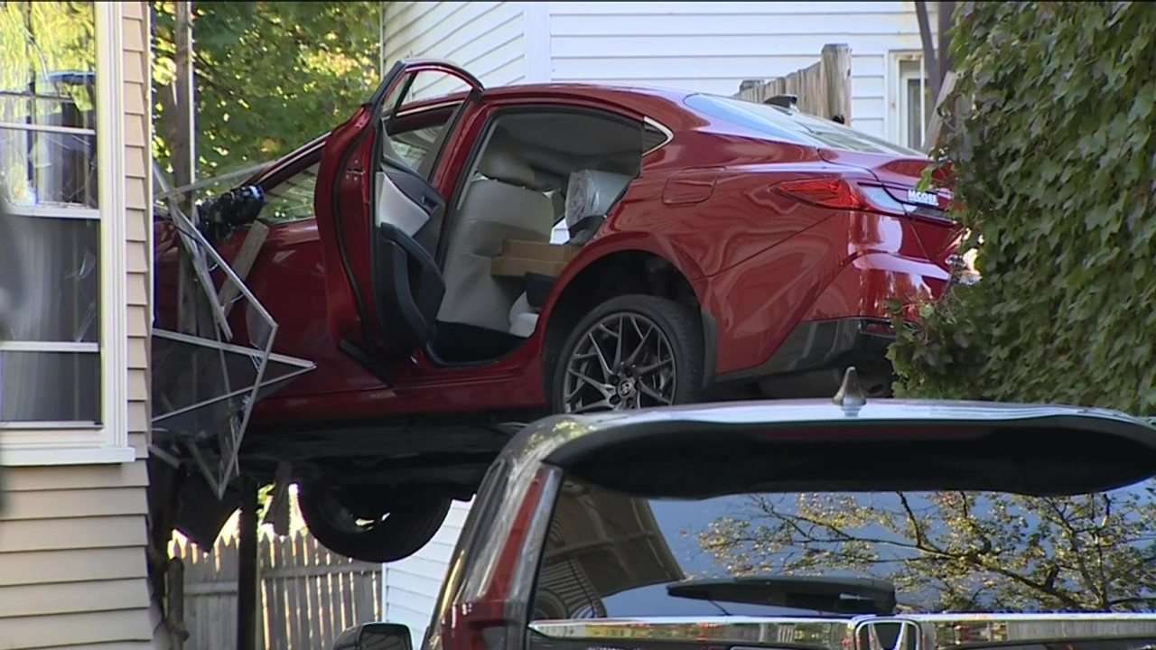 Car barrels through parking lot, crashes into window of home in Jamaica Plain